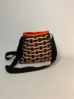 Black, white and orange woven fabric bag