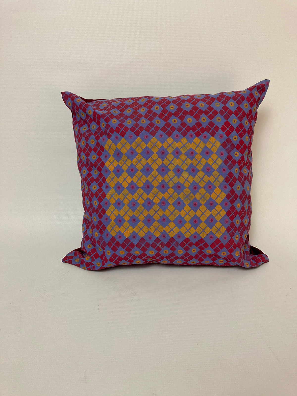 Cushion cover potato print red and mustard on light blue background