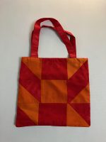 Orange and red patchwork book bag