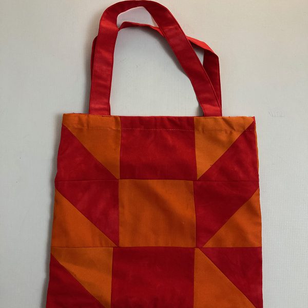 Orange and red patchwork book bag